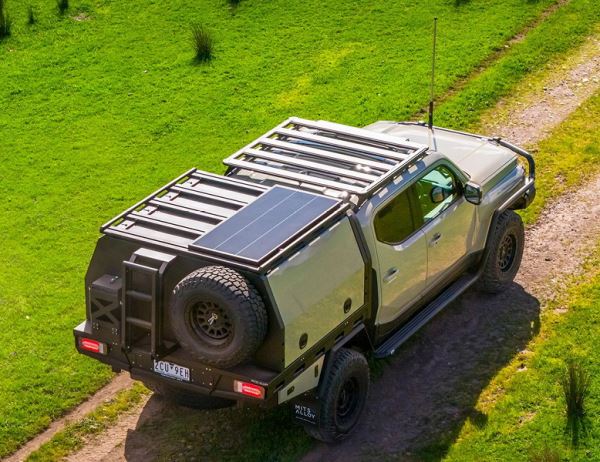 Kia Tasman превратился в приключенческий пикап мечты: мощный силовой бампер, лифт подвески и дом на колесах